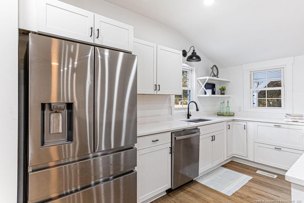 447 T T Johnson Road Carthage, NC 28327 - Photo 20 of 49 a kitchen with appliances cabinets and a sink
