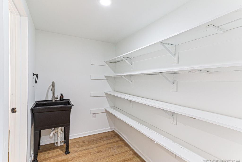 447 T T Johnson Road Carthage, NC 28327 - Photo 25 of 49 a view of walk in closet with empty racks