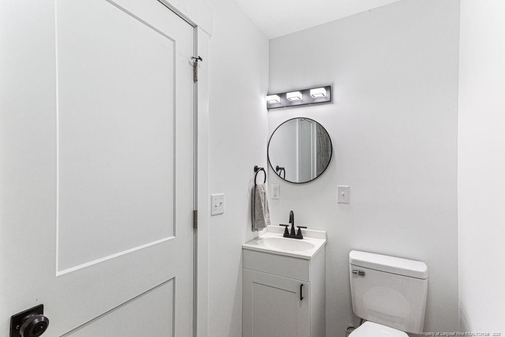 447 T T Johnson Road Carthage, NC 28327 - Photo 29 of 49 a bathroom with a toilet and a sink
