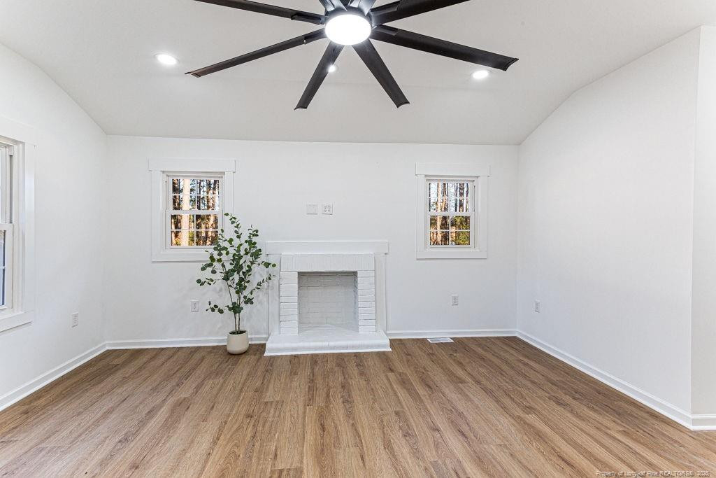 447 T T Johnson Road Carthage, NC 28327 - Photo 30 of 49 wooden floor in an empty room with a window