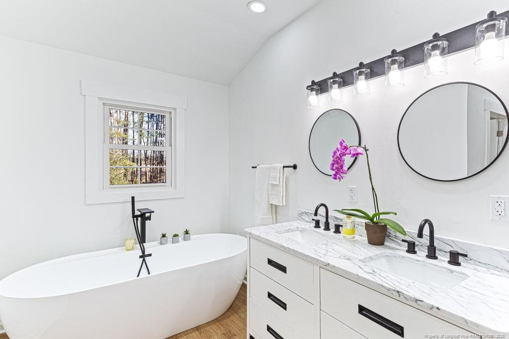 447 T T Johnson Road Carthage, NC 28327 - Photo 36 of 49 a bathroom with a sink and a mirror