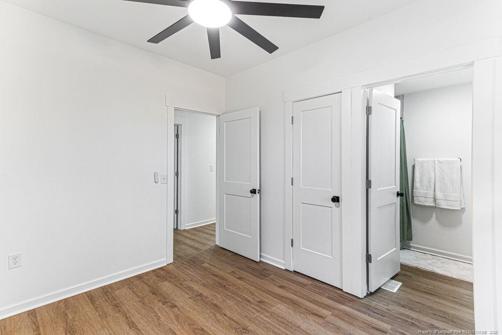 447 T T Johnson Road Carthage, NC 28327 - Photo 37 of 49 a view of an empty room with wooden floor