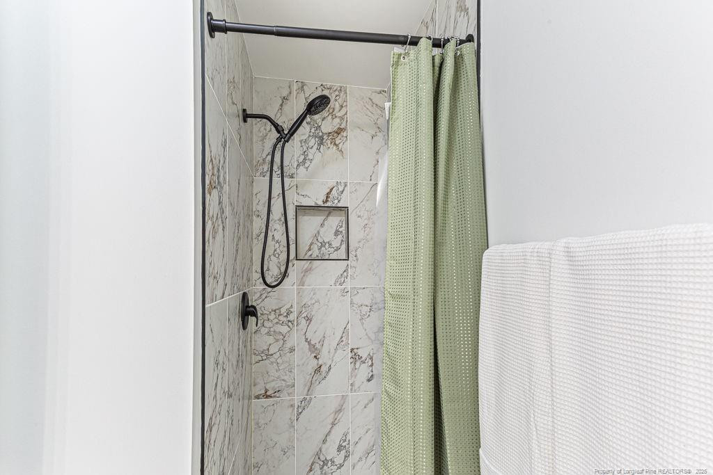 447 T T Johnson Road Carthage, NC 28327 - Photo 39 of 49 a bathroom with a shower