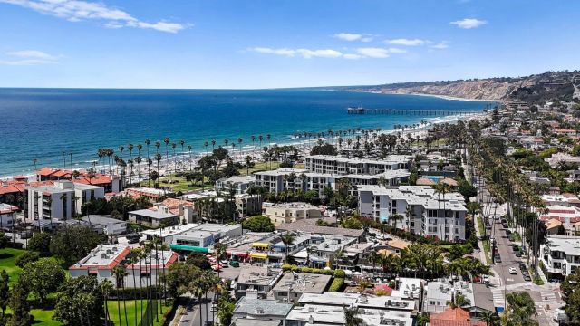 a view of city with ocean