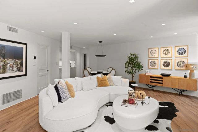 a living room with furniture and white walls