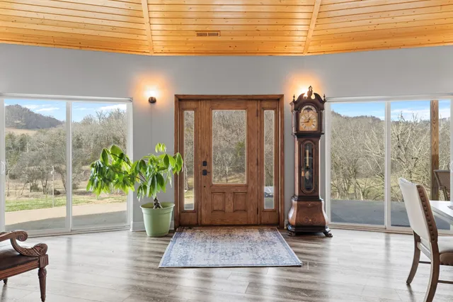 a dining room with furniture and wooden floor