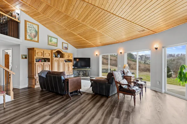 a spacious bathroom with a double vanity sink a mirror and a shower