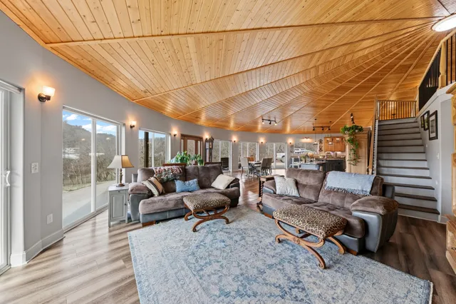 a spacious bathroom with a double vanity sink a mirror and shower