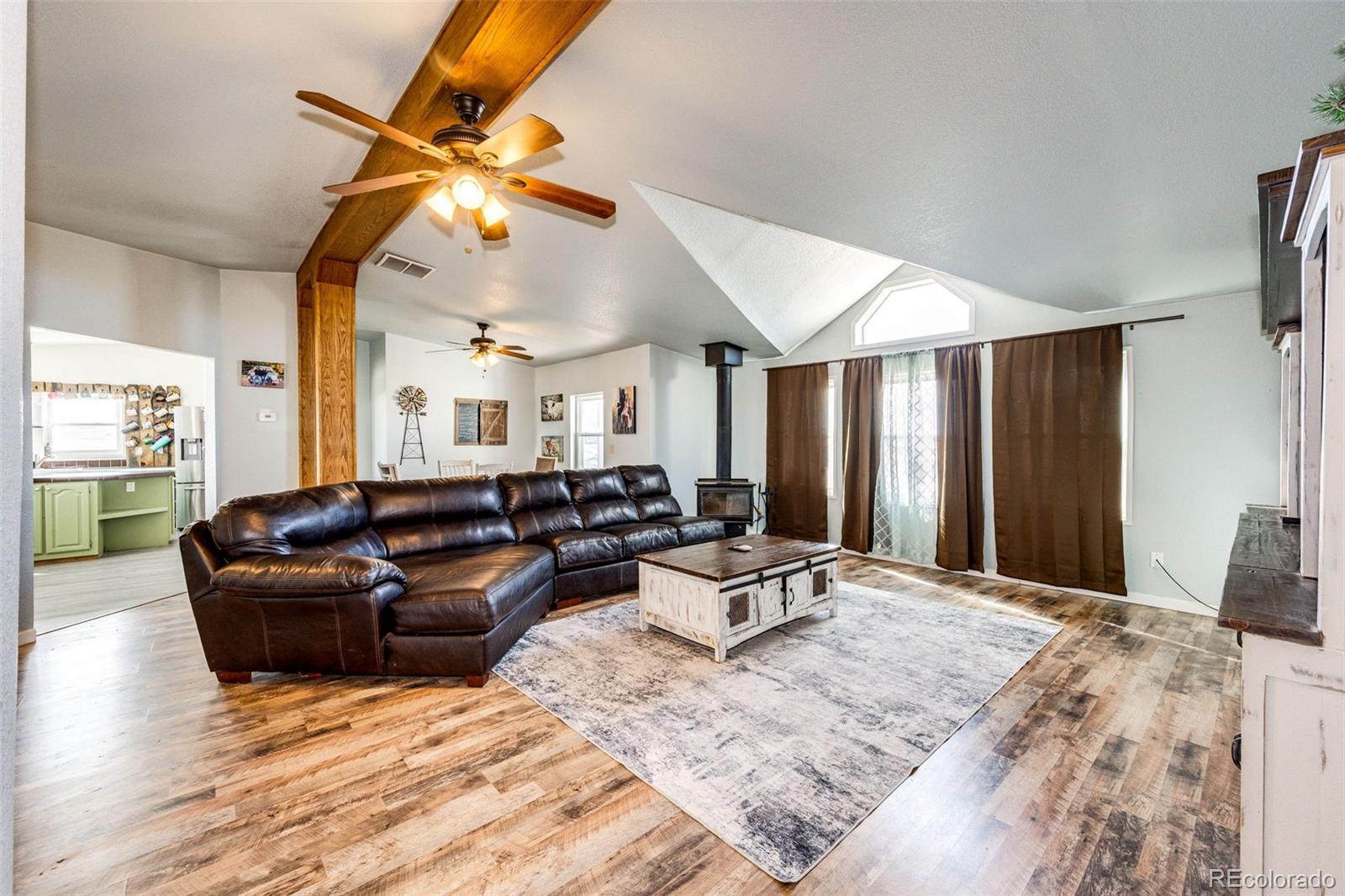 26101 Flower Circle Simla, CO 80835 - Photo 1 of 48 a living room with furniture and a flat screen tv