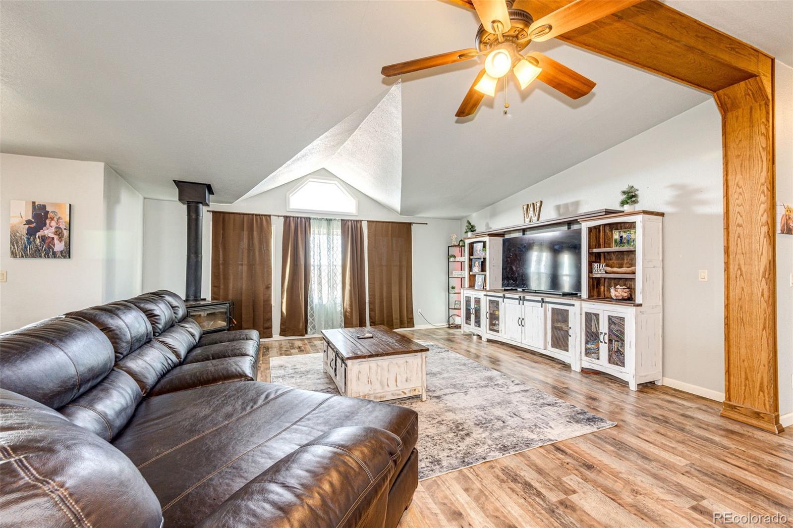 26101 Flower Circle Simla, CO 80835 - Photo 3 of 48 a living room with furniture and a flat screen tv