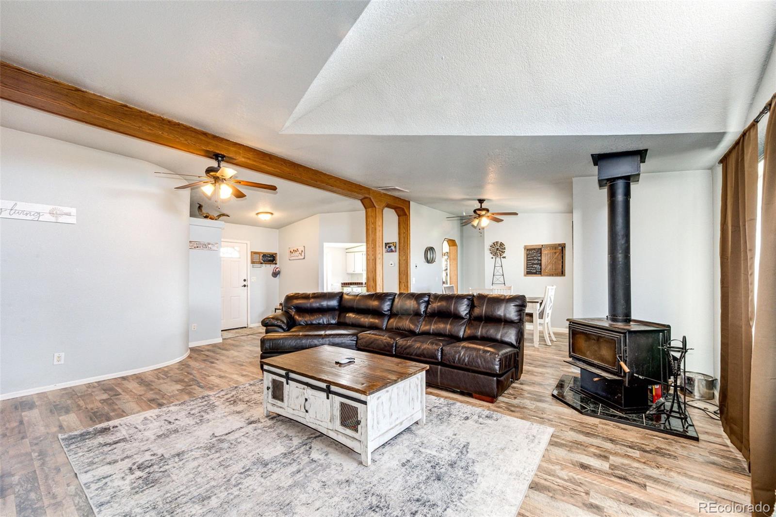 26101 Flower Circle Simla, CO 80835 - Photo 5 of 48 a living room with furniture gym equipment and a flat screen tv