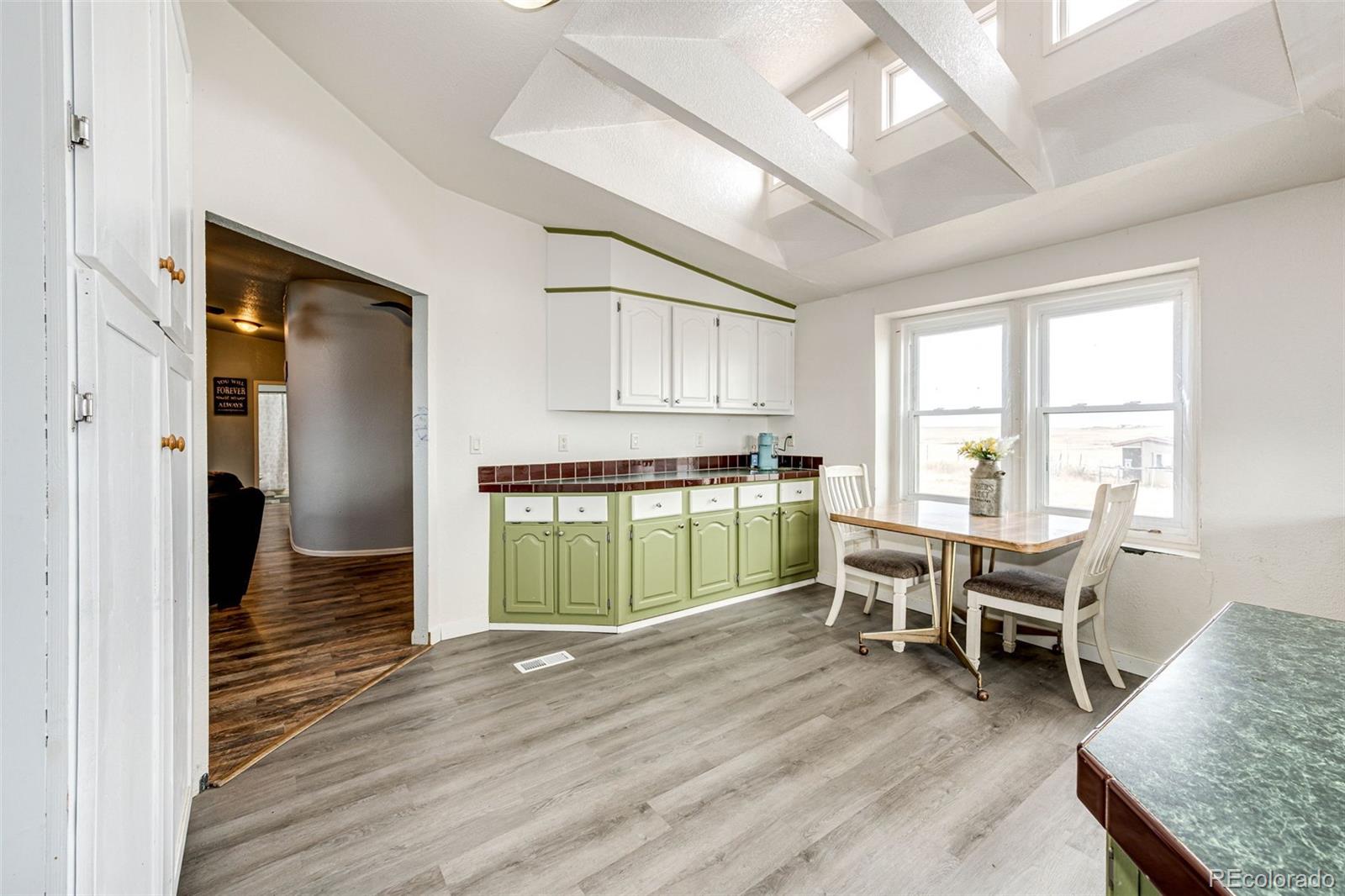 26101 Flower Circle Simla, CO 80835 - Photo 10 of 48 a living room with furniture and a wooden floor