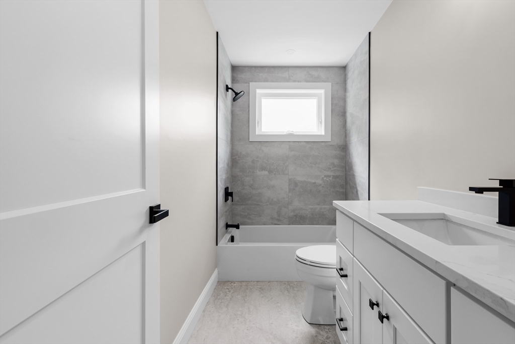 122 Stowe Street, Unit 122 Fall River, MA 02720 - Photo 11 of 26 a bathroom with a sink a toilet and shower