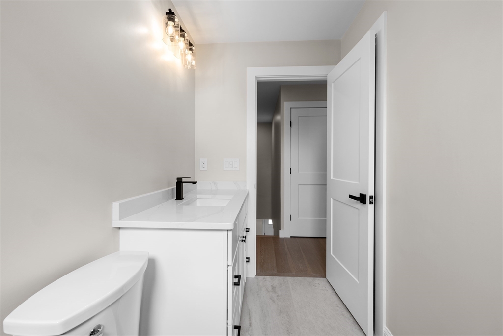 122 Stowe Street, Unit 122 Fall River, MA 02720 - Photo 12 of 26 a bathroom with a sink a toilet and shower