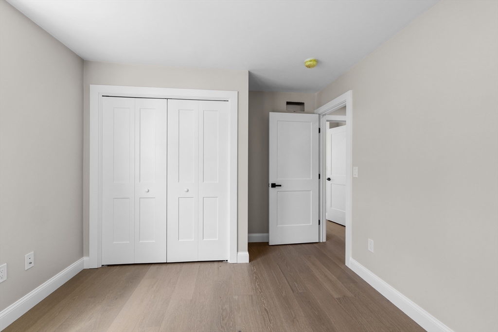 122 Stowe Street, Unit 122 Fall River, MA 02720 - Photo 18 of 26 a view of an empty room with closet and a window