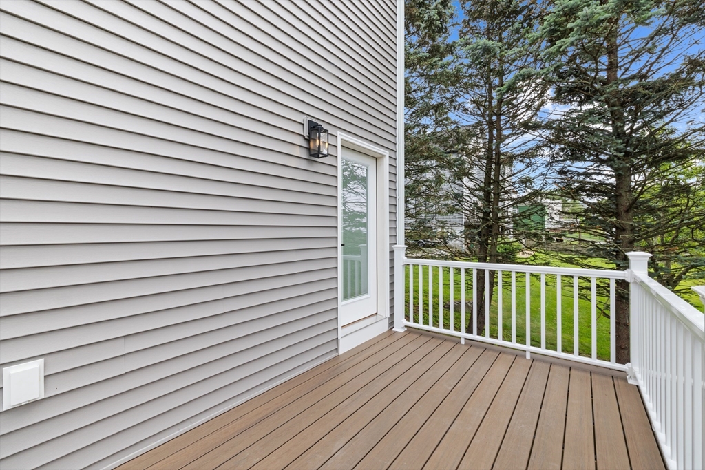 122 Stowe Street, Unit 122 Fall River, MA 02720 - Photo 24 of 26 a view of a wooden balcony