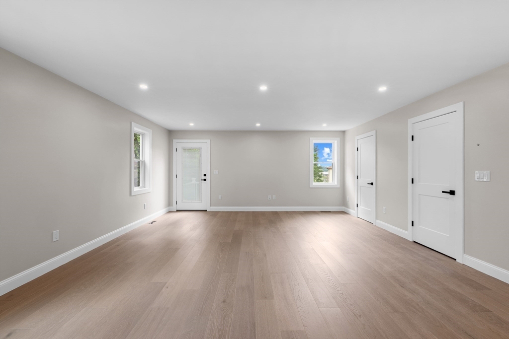 122 Stowe Street, Unit 122 Fall River, MA 02720 - Photo 9 of 26 a view of an empty room with wooden floor