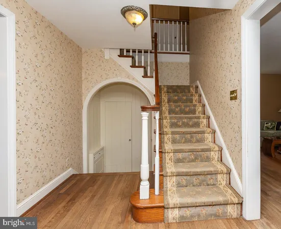 a view of staircase with white walls and white floor