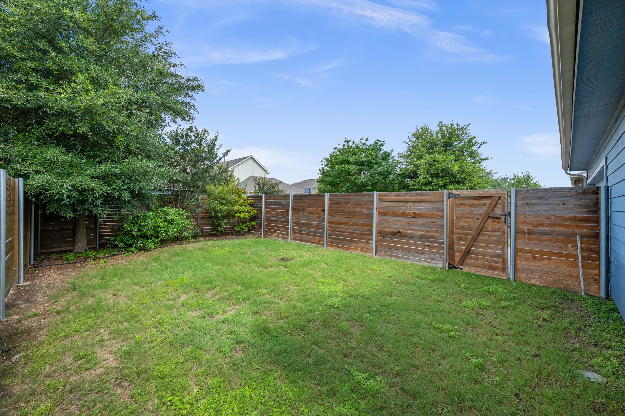 8800 Slater Drive Austin, TX 78747 - Photo 29 of 40 a view of a yard with wooden fence