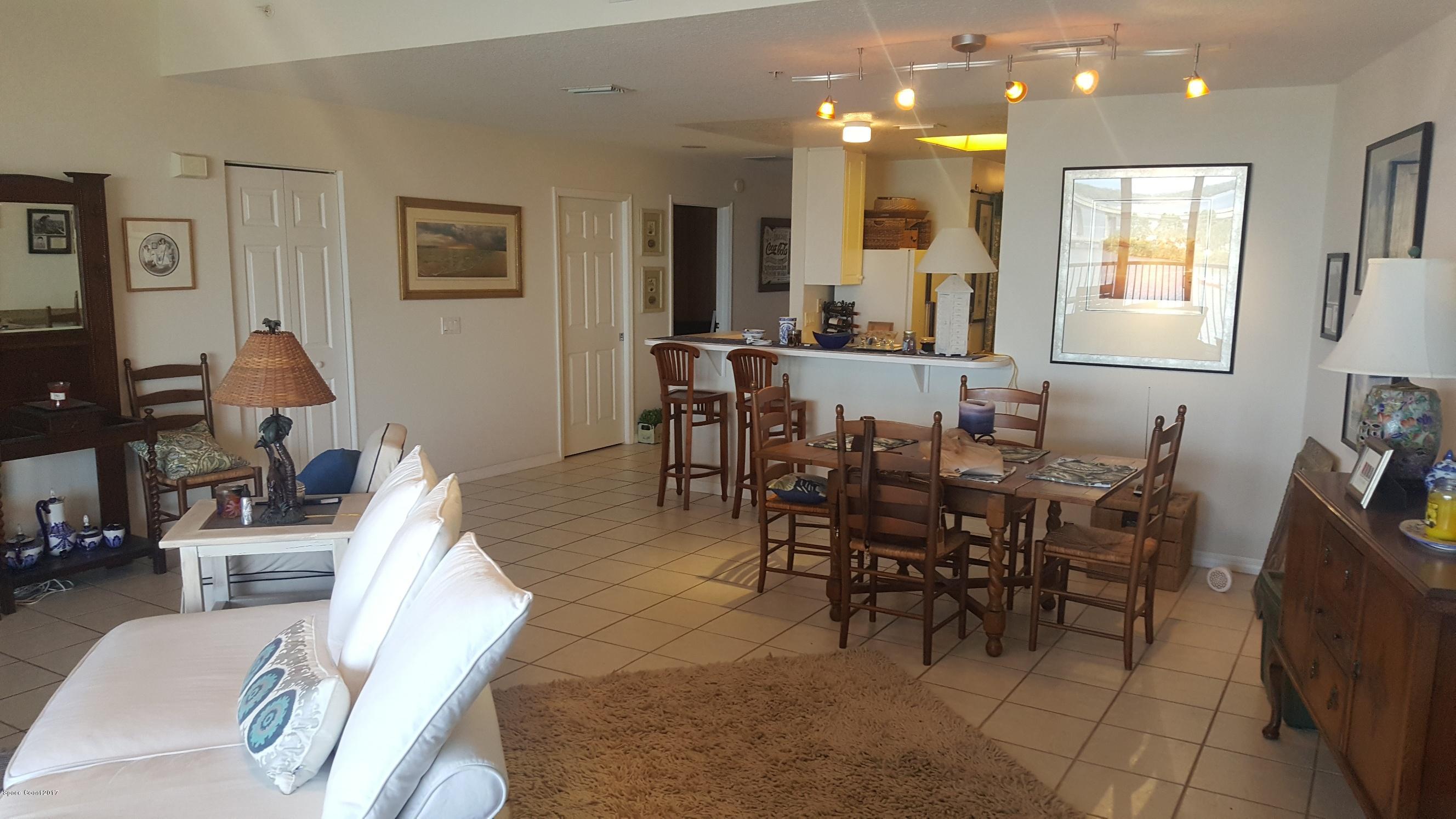 100 Riverside Drive, Unit 804 Cocoa, FL 32922 - Photo 3 of 11 a view of a dining room with furniture