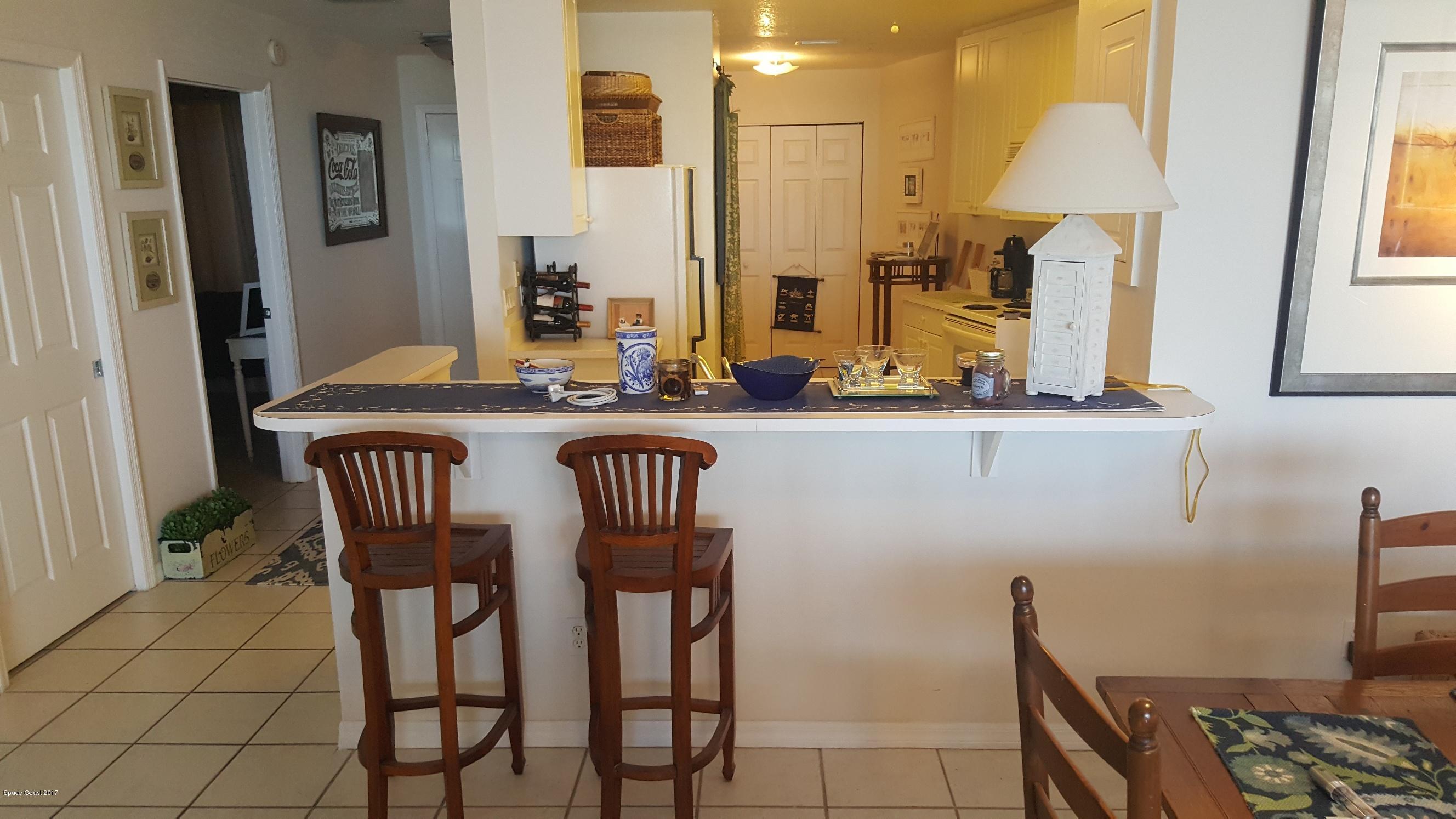 100 Riverside Drive, Unit 804 Cocoa, FL 32922 - Photo 4 of 11 a dining room with furniture and window
