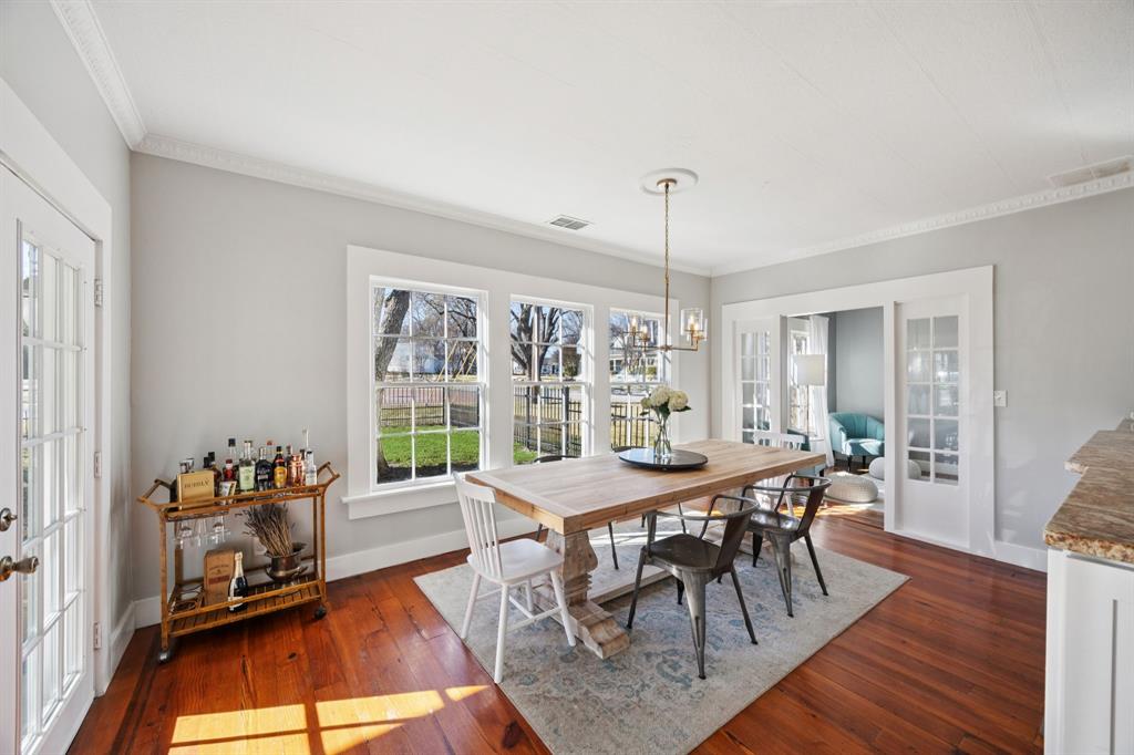 704 Williams Street Rockwall, TX 75087 - Photo 12 of 39 a view of a dining room with furniture window and wooden floor
