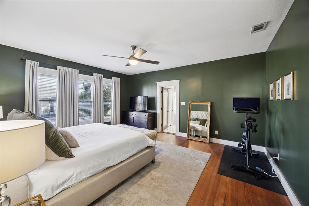 704 Williams Street Rockwall, TX 75087 - Photo 20 of 39 a bedroom with a large bed and a large window