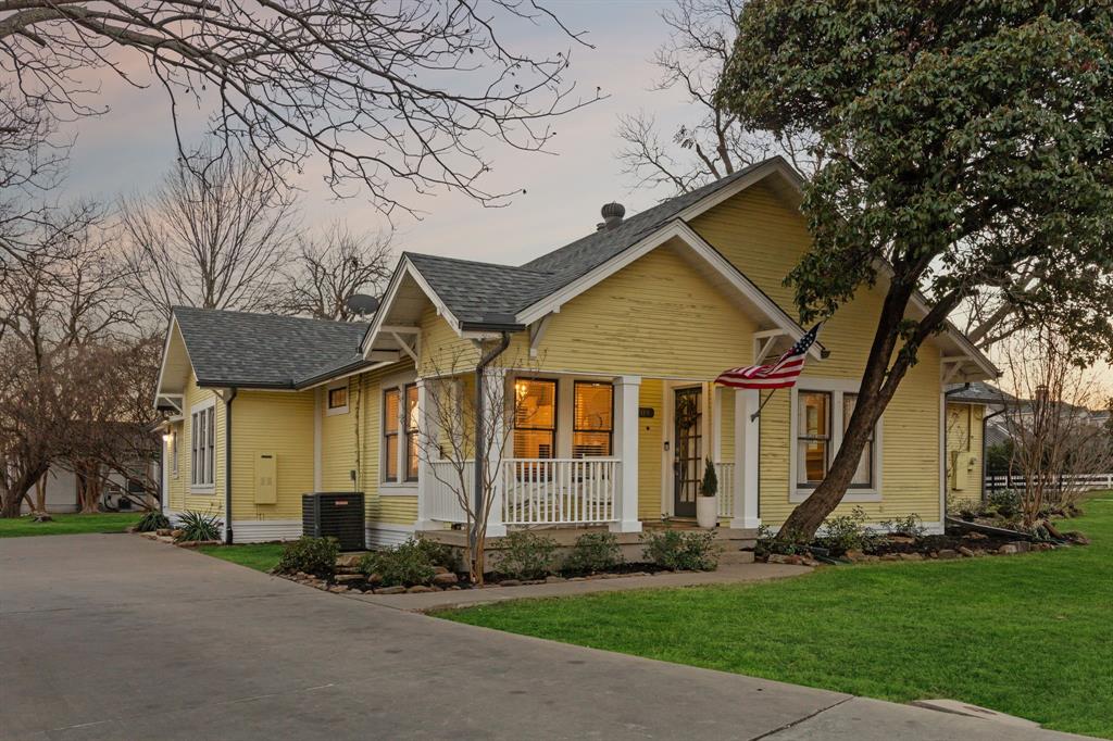 704 Williams Street Rockwall, TX 75087 - Photo 2 of 39 a front view of a house with a yard