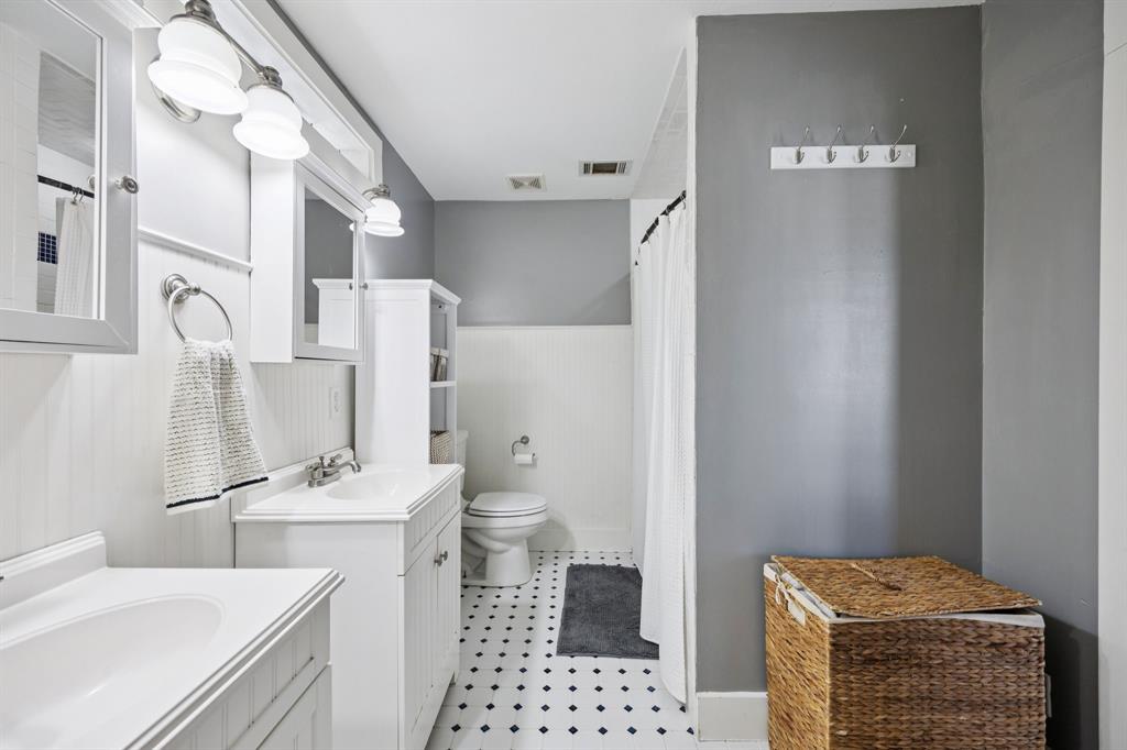 704 Williams Street Rockwall, TX 75087 - Photo 22 of 39 a bathroom with a sink toilet and shower