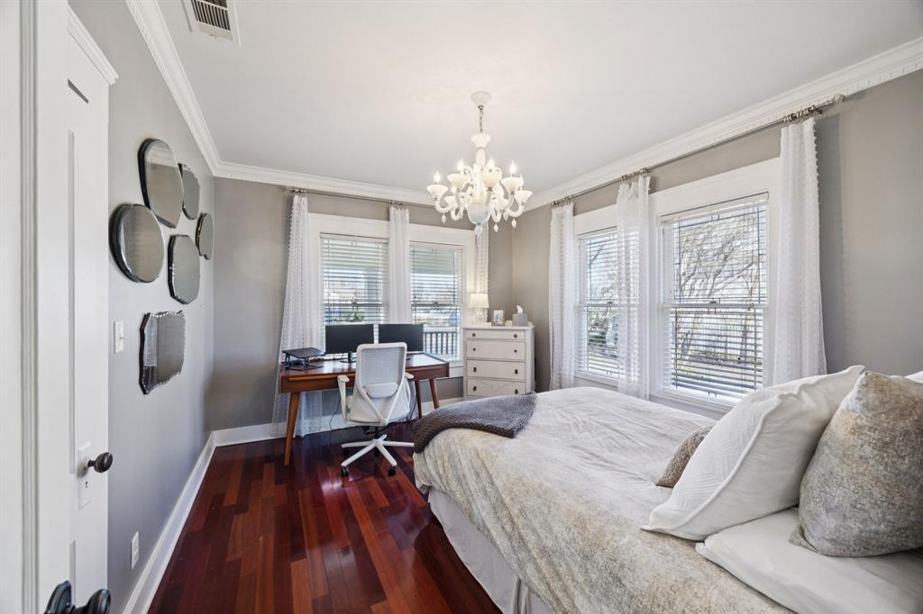 704 Williams Street Rockwall, TX 75087 - Photo 23 of 39 a spacious bedroom with a bed and a large window