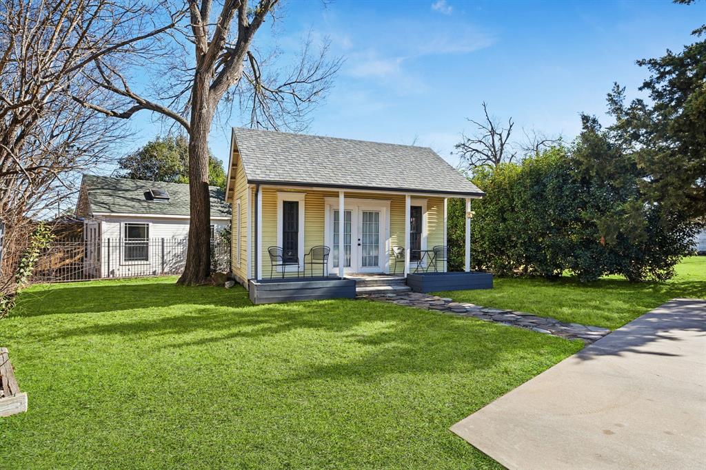 704 Williams Street Rockwall, TX 75087 - Photo 35 of 39 a view of a house with a yard and sitting area