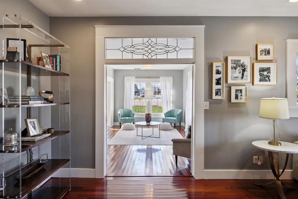 704 Williams Street Rockwall, TX 75087 - Photo 9 of 39 a view of a livingroom with furniture cabinet and wooden floor