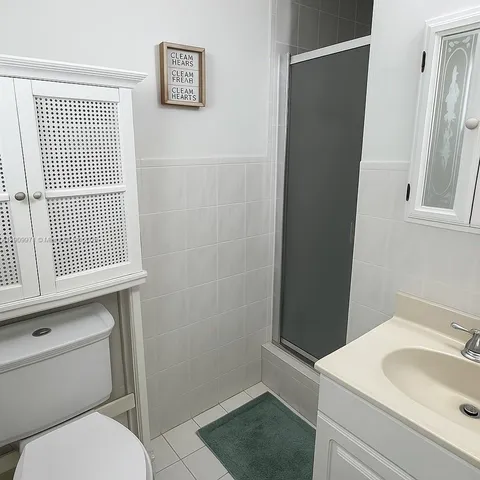 a bathroom with a sink toilet and vanity