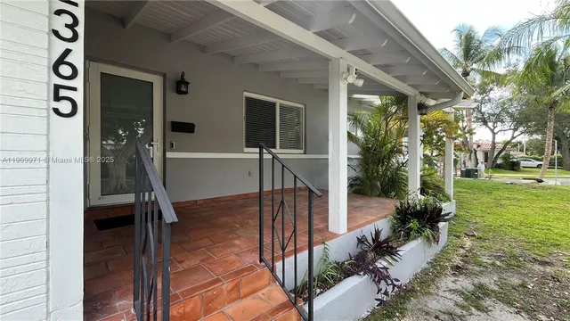 a view of backyard path with seating space