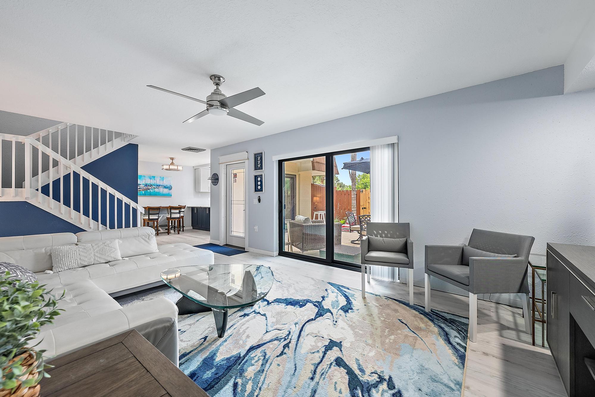 2902 29th Court Jupiter, FL 33477 - Photo 11 of 24 a living room with furniture and wooden floor