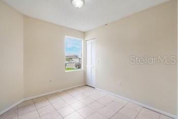 1032 Inkberry Court Orlando, FL 32811 - Photo 13 of 16 an empty room with windows