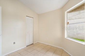1032 Inkberry Court Orlando, FL 32811 - Photo 15 of 16 a view of an empty room with a window