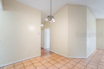 1032 Inkberry Court Orlando, FL 32811 - Photo 8 of 16 a view of a chandelier in a room