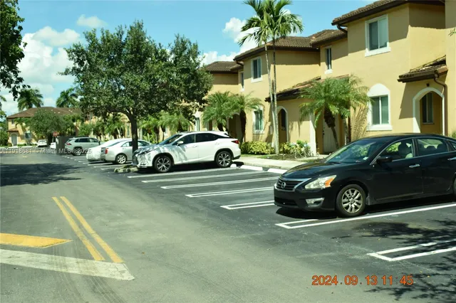 a view of a car in front of a house