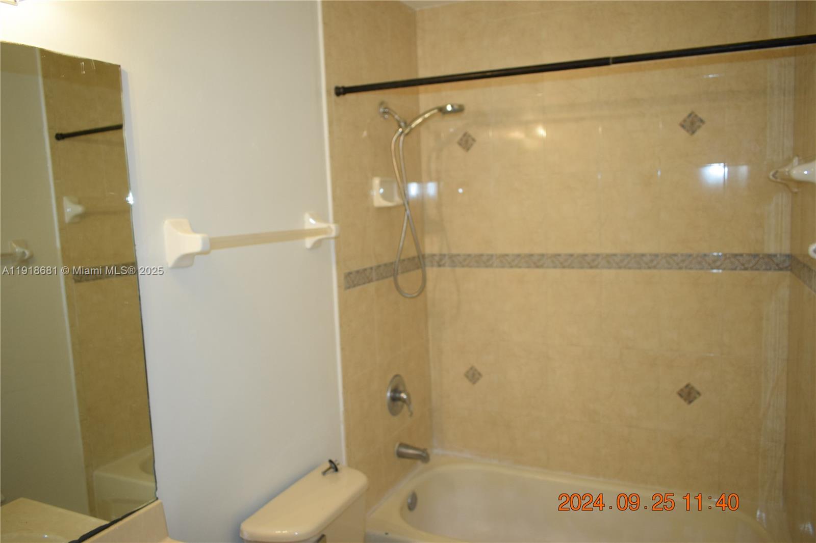 12080 Southwest 268th Street, Unit 28 Homestead, FL 33032 - Photo 15 of 25 a bathroom with a shower and a bath tub