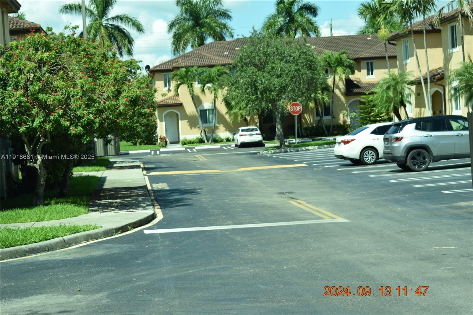 12080 Southwest 268th Street, Unit 28 Homestead, FL 33032 - Photo 21 of 25 a view of a park that has a parked car parked