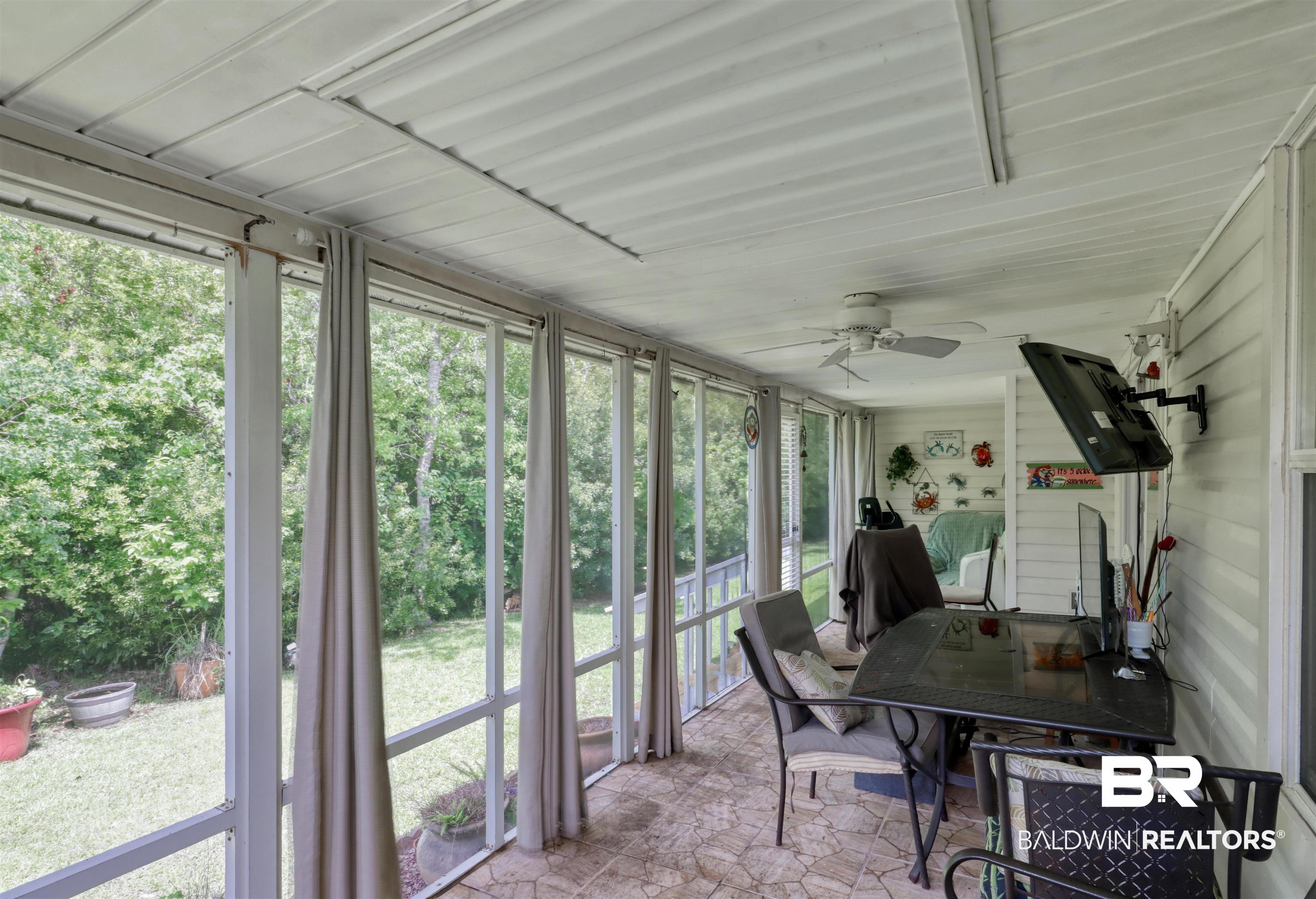 3200 Loop Road, Unit 61 Orange Beach, AL 36561 - Photo 18 of 32 Sunroom / solarium featuring ceiling fan