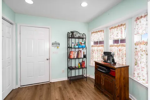 a view of an entryway with wooden floor