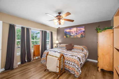 a bedroom with a bed and a window