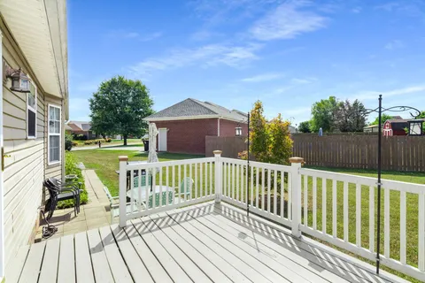 a view of a chair and tables on the roof deck