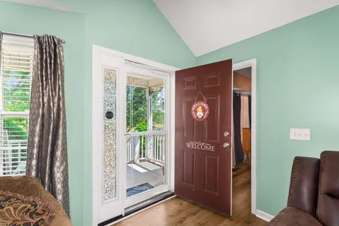 a view of livingroom with furniture and front door