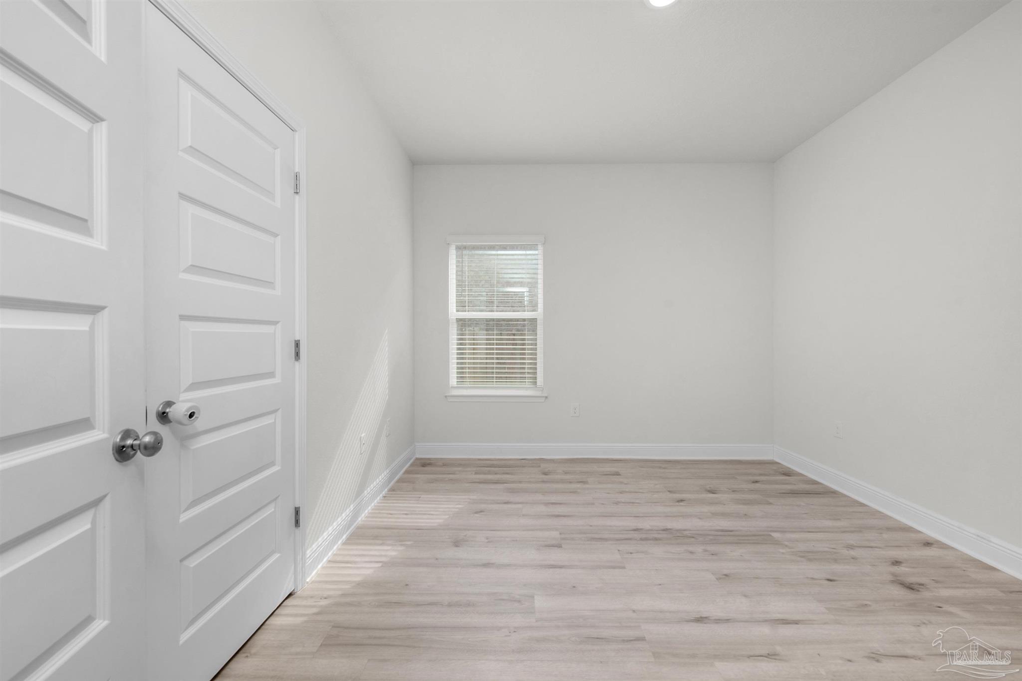 7814 Burnside Loop Pensacola, FL 32526 - Photo 11 of 41 wooden floor in an empty room