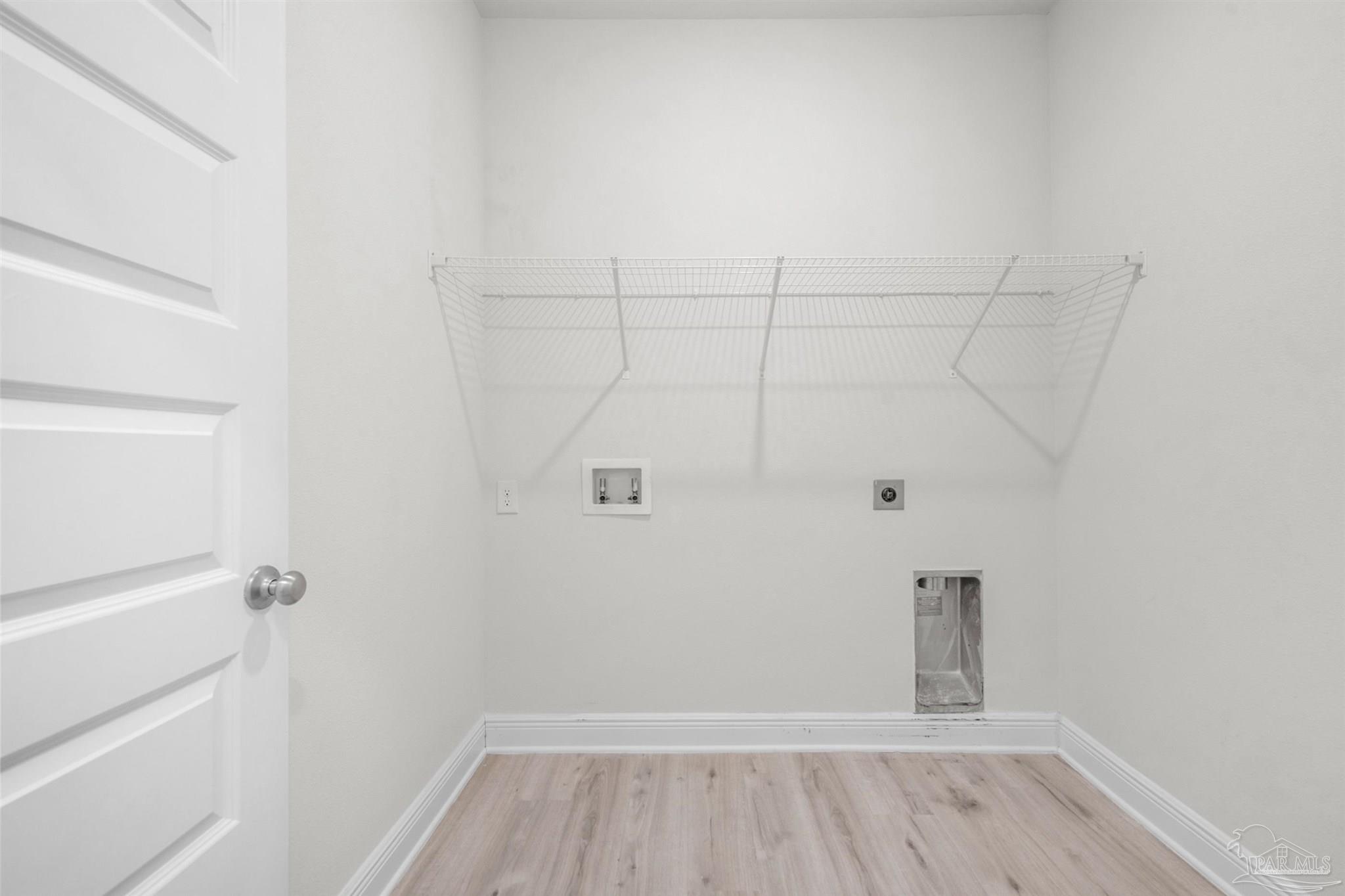 7814 Burnside Loop Pensacola, FL 32526 - Photo 13 of 41 a view of a room with wooden floor