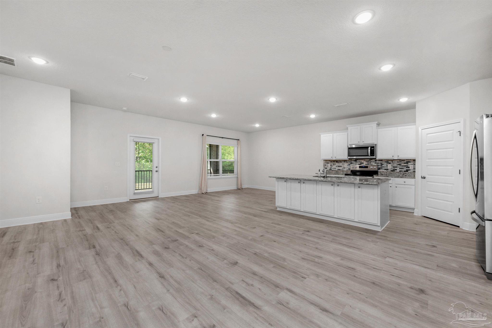 7814 Burnside Loop Pensacola, FL 32526 - Photo 15 of 41 a view of kitchen with granite countertop cabinets and refrigerator