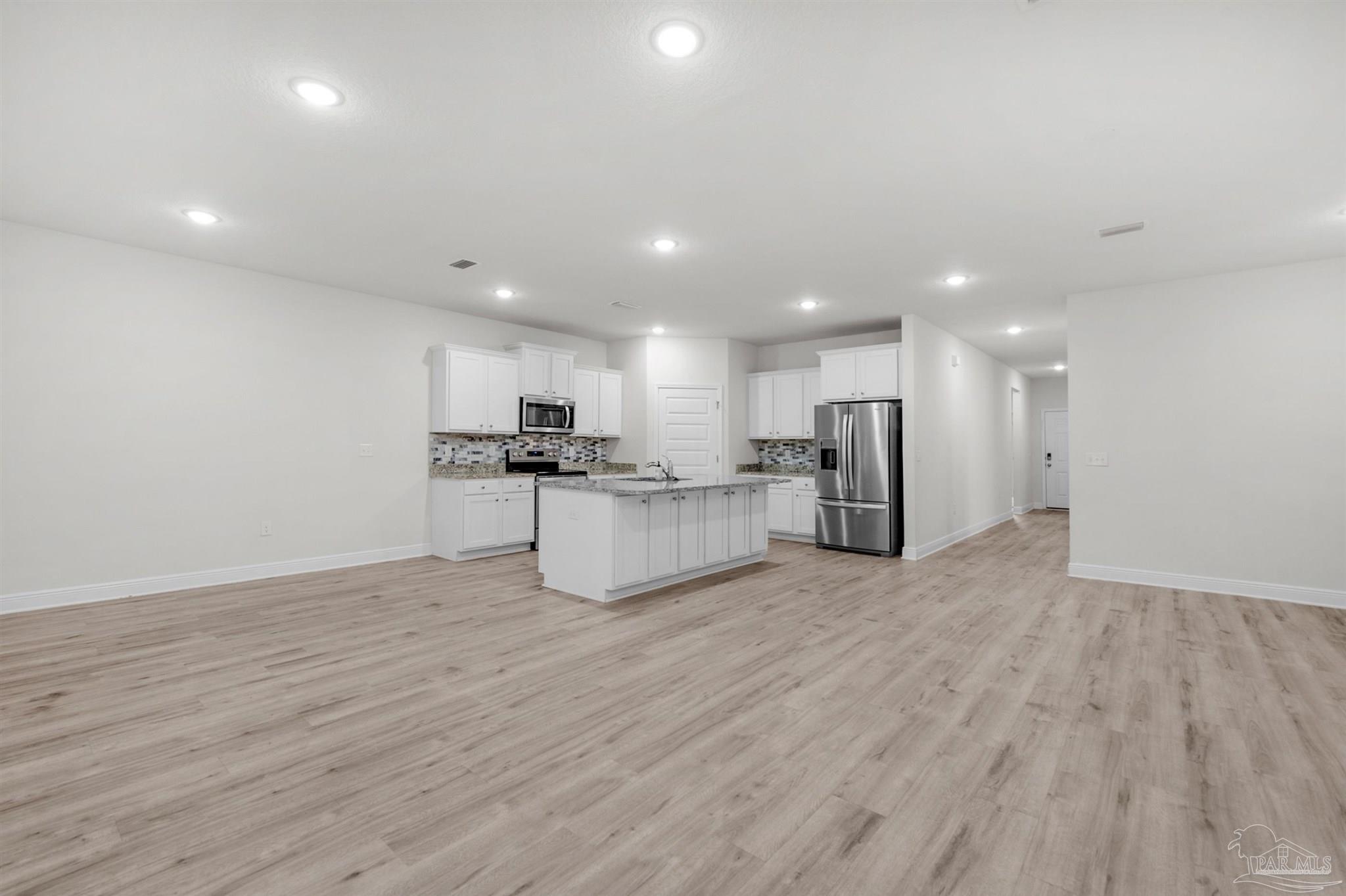 7814 Burnside Loop Pensacola, FL 32526 - Photo 17 of 41 a view of kitchen with wooden floor